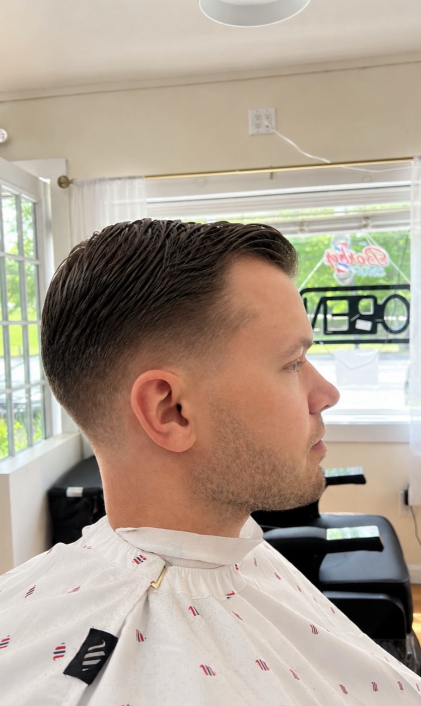 Sharp taper fade with a crisp part